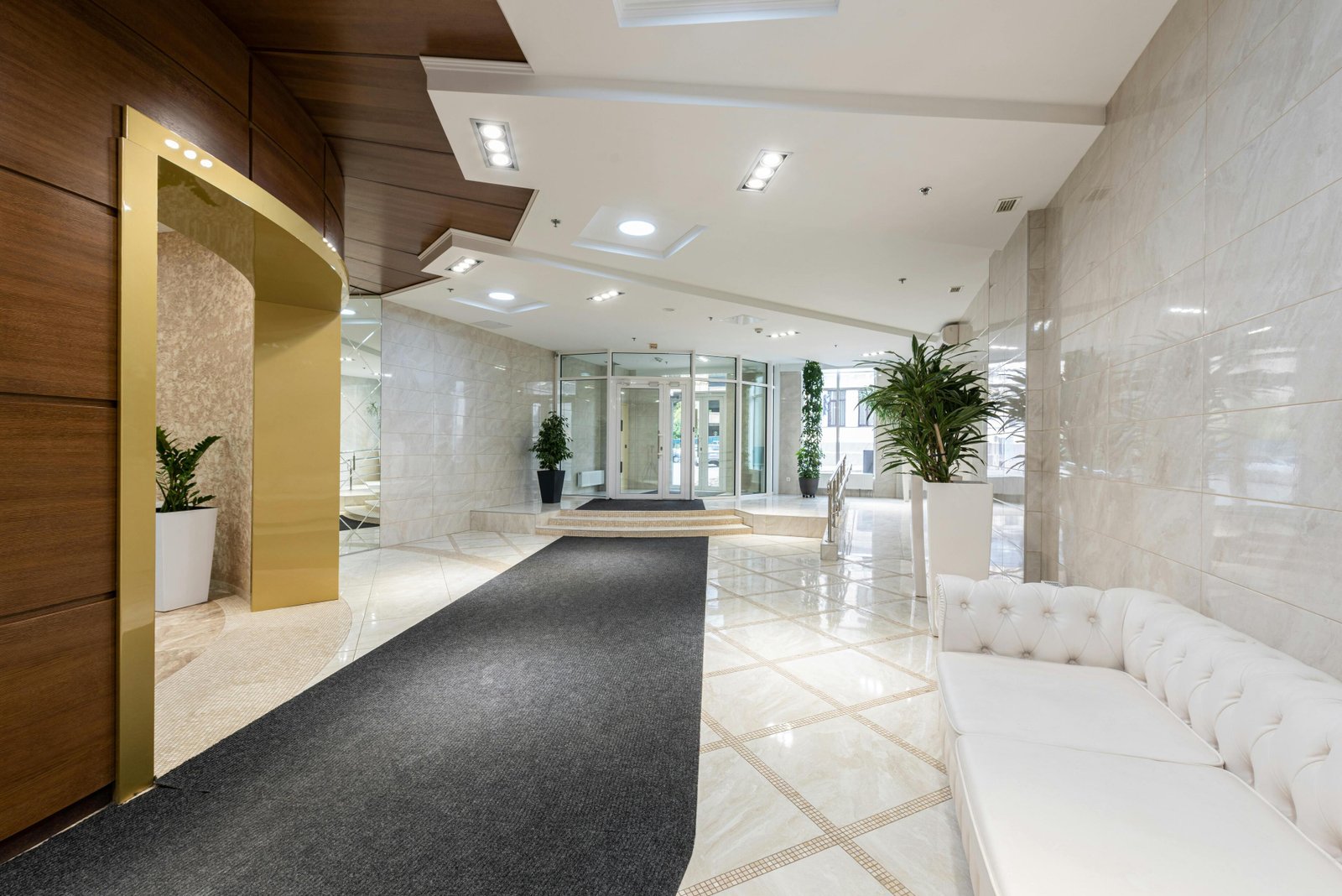 Lobby corridor with polished marble flooring and wall cladding